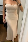 If you are possibly between sizes, size up because of the stretch in the fabric. It will pull on all the right places, and unfortunately, all the wrong ones too. Thankfully long enough. - Alexandra F.