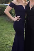 I got this dress for a formal event and loved it! It it made of thick material and there are two layers. Unlike most strapless dresses, i didn't have to keep pulling this one up; it stayed in place the entire night. It is super long! I am 5'2 and wore four inch heels. I did not get it hemmed beforehand. - Vanessa D.