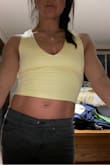 I was on the fence whether to order S or M. I went with S and I think so far it's been the right move, though the black feels more snug than yellow. Some girls said no bra was okay, but after nursing two kids I'm not so sure :D can NOT wait to take these to a warm place (not here in Colorado) and rock these sexy tops. - Judith R.