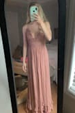A little bit around my waist but i am petite so it was to be expected. Still so gorgeous I'll just have it taken in a bit! Also It's super cute with a loose sweater over it! It was the perfect length for me being 5'2 and wearing sandals. if i wore heels my feet would show more. - Ashley B.