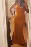 I am normally between a small and medium depending on the brand. I ordered the medium and it worked but was loose and not very flattering. Exchanged it for a small and WOW! Fit perfectly and was so flattering. It is really comfortable material too! A few snags on the material when I got it, so not sure if will snag easily when I wear it (it will be a bridesmaids dress). Might try to exchange for a new one with no damage. Other than that, a super flattering and comfortable dress that's well sized! - Rita K.