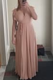 I usually wear a size 12, and the L fit perfectly. I was worried about the bust as I wear a 36DDD, but it was perfect. The dress falls very nicely and it flattering. I am ~5'9" and the dress just skims the floor. The blush color is very light, I will need to have more of a tan as it washes me out a bit with my blonde hair. - Christine H.