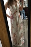 The material is very nice quality. There are a bunch of strings after you open it up completely, but it's not too difficult to figure out which are supposed to go where. Perfect dress for my bridal shower! - Brittany W.