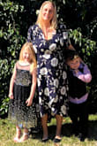 I ordered this two sizes up in a 2xl (normally wear a large) because I'm 6 months pregnant. The fit was so flattering, I loved the high low and the feminine sleeves. I was relieved there was so much material and had no issues with coverage over my bump. Really pretty dress! - Lisa A.