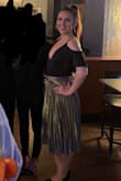 I got this skirt to dance in and it is so fun to spin in! It fits nicely around the waist and is a good length. I would say it's a little more gold in person and the undertone does make it a little hard to wear anything but black with it, but overall very happy. - Rachel L.