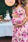 Bought this dress in a large for my baby shower (normally I am a small), hoping it was going to fit my 7 month bump and it fit it perfectly!! I did have to get the bust tailored since it hang a little low and exposed more than I'd like. But If your busty it'll be great! - Christine C.