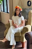 I wore this jumpsuit to my bridal shower and it was perfect for the occasion! I felt beautiful and got a lot of compliments. It is fully lined so undergarments do not show. The tie at the waist is flattering and the XS was the perfect length for my torso. I had to get the pant legs hemmed, but not a big deal. When it's on the hanger, it looks a little yellow, but when it is on and also in pictures, you can't tell. - Kaileen P.
