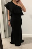 This dress is a cheap material: shows EVERY detail. I am wide but thin, and you can see lumps on my hips in the photo... not even sure what they're from?! Super unflattering. I tried both a M and a L and the L "fit" but there's no way I'd wear it. - Maggie C.