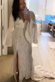 I said "yes" to this dress! Love the drama in the sleeves and the plunge neck, oh and the gorgeous lace train. I felt amazing and got soooo many compliments. No one could believe the price! - Ting T.