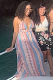 I get compliments on this dress all the time! It's very flowy, and the material is soft. You can tie the straps in different ways to make the dress look more creative. Definitely recommend! - Cara W.
