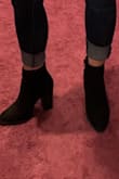 I adore this bootie, the price was perfect and so is the height! They run a little big (on me personally), but honestly, I can wear a 5 or 5.5 so it's a toss-up. I just need to wear thicker socks than my usually no show low cut ones. Very slippery at first, so make sure you scuff the bottoms a little. - Nicole P.