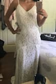 I had originally bought I small and was super disappointed when it didn't fit me right. I have wide hips and I felt like it was too tight in the wrong places. I decided to try a medium and so happy that I did! It fits and feels so much better. I'm obsessed. It's going to be my wedding dress! - Shannon M.