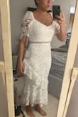 I knew the dress wouldn't hit me exactly where it hits the model in the product image since I'm 5'4", but it is literally a couple inches off the floor. I love this dress's quality (the lace is pretty, the cut is flattering, the construction is done well, and it feels like it sucks me in), but the length holds me back from wearing it unless I get it altered which would be interesting to try to do. I think if you're closer to 6 foot tall or have really long legs, you're good to go. But if not, it might hit you funny too. - Macy I.