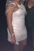 I ordered this dress for my bachelorette party and in person, the dress is beautiful. Quality feels great to the touch, etc. On the body, the dress felt fine so I kept and wore out to the club. Out and about, the dress twisted all different directions, the lining rode up and I was dancing by myself away from anyone rubbing against me.The top gapped and I don't have extremely small boobs by any means and by the middle of the night, I just wanted to go home to take this off. I am lending most of my white dresses to my bridesmaid who's getting married in June and won't be bothering to send this one with her for all the above reasons. You can see the gapping in the photo I attached and the lining has rode WAY up from where it's supposed to be and this is just from walking into the club and grabbing a drink. The twisting made me look bunchy and larger than I am. - Macy I.