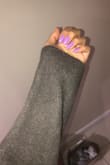 I was reading the reviews when I was deciding to order it, and there was a concern that the sleeves are too short. I'm 5'6 and thankfully the sleeves were just fine, and past my wrist actually. I love the material and it keeps me warm. Occasionally it does feel itchy on bare skin, but it's not so bad. - Angela L.