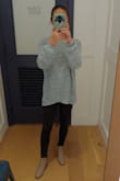 I am obsessed with this sweater!  I love the color and the details in the back. It's slightly big on me but that's the style and was expected.  Love pairing it with leggings and ankle boots. - Adelane A.