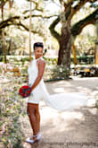 I have always wanted a really short wedding dress. This dress is exactly what I envisioned! It's vivacious and artsy. The short white dress accompanied with the sheer skirt creates the perfect unconventional look. I debated ordering a medium because my bust and waist measurements indicate a size small, but my hips suggest a medium size. The top of the dress is the perfect fit, but the area around my hips is a little tight. The material is pretty stretchy. This dress looks absolutely stunning in photographs. - Elizabeth J.