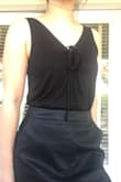I got this on sale. It's cute, the material is soft. Basic black tank top that I can wear a lot. - Grace F.