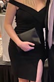 I purchased this dress for a wedding and it was even better than I expected. I received many compliments. The off the shoulder sleeves stayed put because they have a gripper material on them. The fabric is thick and stretchy. I usually only wear dresses once but I can't wait to wear this one again! - Kelly M.