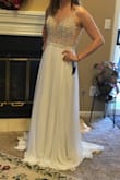 This dress fit great. The straps were too long but a tailor was able to fix it in 2 days. I got a lot of compliments. I wore flats so it was slightly too long. If I had heels or wedges on it would have been the perfect length - Elizabeth C.