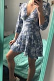 This is a super cute wrap dress with fun movement of the skirt. I don't recommend for tall and lengthy bodies. The tie is awkwardly higher than the natural waist but lower than empire, the sleeves are an awkward length, and one wrong move would expose too much since it's so short. It's a shame, it's very cute but its too short to be appropriate. - Rylie M.