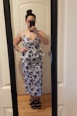 This dress fits pretty well and looks very classy. It was a little looser than expected but not enough to warrant alterations or another size. I know the material says that it doesn't stretch but it actually does have some nice give to it. I am curvy and I was worried the material would be too stiff and tight but it wasn't. Also, no bra needed (unless you have larger breasts maybe). Ignore the shoes in the photos! I was just putting heels on to see for height. I may consider hemming it a little but I think it looks fine if I don't. - Gabriella