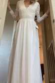 I had ordered this dress in a medium to begin with and it was super big on me. I then ordered it in a small and the sleeves were still a little baggy on me. It's a very good quality dress and would recommend for someone to try. I was looking for a wedding dress and this was my first try. I felt like the waist line wasn't flattering on me. I'm not sure if it was the color or the fit that I didn't like. It was plenty long of you're looking for a dress for a tall woman! - Erin P.