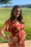 Choose this dress for my maternity photo shoot, I was 26 weeks pregnant for the shoot, I bought a Large and it fit perfectly and flattering over my bump. I have gained 20 lbs so far and the dress made me feel good at about myself and overall pretty and not as pregnant and large as I feel inside! Dress is a bit long but I wore sandals because I can't wear heels right now but it was perfect for my shoot, I felt beautiful and flattered all the right places and dress is forgiving! I feel like the dress is something I can wear post pregnancy and breast feeding friendly! - Ashley H.