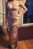 This dress was everything we thought it would be and more! We bought two dresses for prom but couldn't pick just one so we decided to keep both dresses and save one for another special occasion. True to size and really great quality - Raquel G.