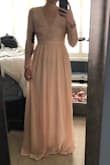 This dress is beautiful. I will wear it on my wedding day. It is exactly what I hoped it would be. It did have an odd odor when I got it but was going to the dry cleaner for wrinkle removal anyways. I did not have a smell after dry cleaning. - Kayla B.