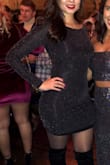 I wore for New Years 2019 and the shimmery parts made it feel very festive and dressy, but the material is very comfortable to wear! It is form fitting and the black slip under the shimmery part did sometimes show. Overall it's a fun party dress and low maintenance - Jennie R.
