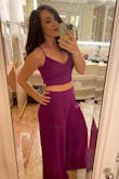 The top fit good but was cinched as tight as it could go (I am pretty small-breasted though) - if this came in separates I would have been great with a small in the top. The bottoms were way too long - I hemmed about 2 inches off before I could wear with kitten heels. The waist fit fine - I had a little bit of space where it could have been taken in but I fear the small pants would have been too much. By the end of the night, after all the food I ate, I was glad my pants were medium. If deciding between fits, just go with the pants since the top has SO much room for error. My only regret was not taking more pictures of me in it since I got a ton of compliments. - Emily L.