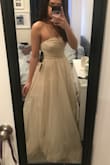 This dress made me feel like a princess! This could possibly be worn to prom or one's own wedding, which would usually be great but I was looking for a dress as part of the bridal party that was glittery and tulle. It looked a little simpler in the photos (so much fancier in real life) The top part needs adjusting in the beginning and it may also need extra padding as it doesn't come with some. It might work for someone taller but since I'm only 5"0 it looks like a ball gown. Amazing, but not what I needed. - Jazreth D.