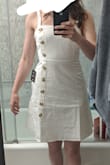 This dress was great, just not exactly my style. I thought it fit well, and the material was high quality. As others have mentioned, the straps are pretty long and not adjustable, but it's an easy fix to pin them in the back. I'm only 5'2", and it was a little longer than I hoped it would be. It also flares out a little more at  the bottom than I usually like. Overall, I thought it was a great dress, just not for me. - Alyssa C.