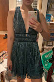 This dress is very beautiful and has a classy cut for a modest yet sexy flash of cleavage. I never wear green and I never feel comfortable showing any cleavage, but my friend convinced me to live a little and try a new cut and color of dress. Didn't regret it at ALL! I loved how the dress has the right amount of shine and a beautiful green color that worked with my skin tone. - Florizza R.