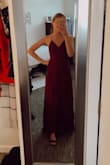 I got this dress for a potential military ball in the plum color. The photos that I took have an edit over them making the dress look a bit redder but it is definitely purple (plum) color. It is NOT burgundy. The dress fits well. It has adjustable straps to help the backside. I'll probably wear nipple pedals with it or sticky cups tbh. It is not padded. It is a simple and classic dress. I am a 32A, with a 27-inch waist and a 35-inch hip. I am 120 pounds and usually an xs or small in everything and the xs worked perfectly with some heels. - Kyla S.