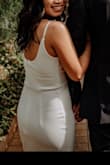 Loved this dress! I had it hemmed and then had the adjustable straps removed, runs a little big but made it work! It's so simple, yet still so stunning. We had a city hall wedding, but had photos taken at a green house and it photographed well! It's a thicker material so you don't have to worry to much about what's underneath, I opted for petal covers! - Allison S.