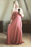 The dress is perfectly fitted in the bust area. Since I'm shorter it's a few inches too long without tall shoes. - Rachel Z.
