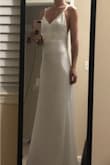I bought this with no reviews on it yet (I love reading the reviews and seeing photos to get an idea of how it will look ahead of spending the money) but I'm so happy I did. It's beautiful quality, not too thin and doesn't show anything underneath it. Love the silky feel and so happy with the purchase. My one complaint would be that the straps will probably need to be shortened about 1/2 an inch, but it really is so stunning and the price point is amazing. In the photos it still is a little wrinkly from being shipped in the bag but once it's correctly steamed and relaxed it is going to be stunning! - Hailey G.