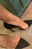 The shoe is very pretty and is a very deep black color, and comfortable despite the high heel. Perfect to wear with work attire or jeans. The only issue I have is that it is narrow and unfortunately there is no medium size. I bought a 7, which is a perfect length and if exchanged for 7 1/2, I fear it will slip off-so I'll make it work. - Rashonda S.