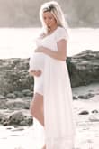 I was crunched on time to be able get a dress for our maternity photos this was PERFECT! Normally, I would be a small, but given the extra little person I'm carrying around (31 weeks) I ordered large. It was actually way too big and I preferred it open with the slip exposed and the drapery part flowy. So thankful this dress pulled through last minute!! - Claire W.