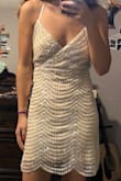 I ordered both a XS and S because I was not sure which one would fit better. Honestly, both of them fit and were beautiful. The XS was on the tighter side which was good and bad. If you wanted a looser skirt then go with the S. But for me, I wanted a tighter skirt and also I did not want it to be too loose in the chest area. However, the S was a lot more comfortable to wear overall. So really the sizing is up to you. But the dress is so gorgeous. Looks white in some pictures, tan in others, silver in some pictures too! It's a really cool dress and design. - Ashley L.