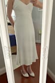 I was surprised by how nice and well made this dress is.  I thought I had read a review that said this dress was like a summer dress.  So, I was thinking the material was lighter and I could wear the dress in the summer (after my wedding).  However, the dress is heavy.  Very much like a wedding dress you would buy at a bridal shop....which is fine, I'm not complaining.  I also had the dress shortened, and attached a photo so others can see the look as an option. - Shannon M.