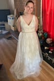 This dress is incredible. The lace is so soft and the beaded belt is the perfect accent. I wasn't crazy about the tulle in the skirt but it'll be easily altered to let that beautiful lace shine. The top is just a tad big in the shoulders but again should be easy to alter. - Elizabeth R.