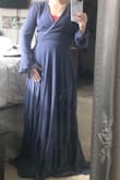 I loved this dress! It was seriously dreamy. I'm so sad I had to return it. The midsection hit me pretty low, but I'm really short and my torso is very short, too. The wrap midline was at my hip and there were a good 6 inches of the dress on the floor that I didn't want to pay to have hemmed. I will say that the color was a little more purple in person, too. I got this thinking I could use it as a maid of honor dress for my sister's wedding but she wanted a dusty blue, and this was more of a dark/dusty purple. - Audri W.