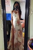 I bought this last Spring for my junior prom, and I loved it! I'm very short, so even the XS was long, but my mom and I just hemmed the bottom a bit and it was perfect! I loved that it was a wrap dress, so I could adjust the waist section however I wanted, which is great for petite gals. Would definitely recommend this! - Veronica K.