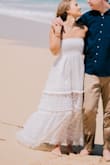 Wore this dress for my engagement photos and it was beautiful! It hit me at ankle length and fit wonderfully. I'm a 32 B and the dress was a bit snug up top so I would recommend sizing up if you are larger chested. The detailing in the skirt is delicate and beautiful! - Rosa P.