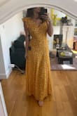 Just received this dress in the mail today and I am in love. The medium fits me perfectly- it cinches at the waist and is the perfect length, just touching the floor. The fabric is super comfortable- light and flowy. I've put it on without a bra and think it would be perfectly fine to wear that way. The open back is beautiful. Can't wait for an opportunity to wear this! - Lauren C.