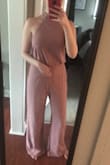 Absolutely love this jumpsuit and the way it looks on me. Was worried when I ordered it that it would zip but it's perfect! A little long at the bottom but will be wearing heals for my sisters bridal shower so will be fine for me. If purchased might need to get hemmed but other then that it's absolutely perfect! - Emily E.