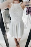 Purchased this dress for my upcoming bridal shower. It is so cute! I tossed back and forth between buying a small or a medium. I ordered the small. It fits amazing, not too tight or too loose. Luckily the zipper in the back goes down pretty far other wise I would not be able to get it on or off as the waist is not stretchy at all. - Colby R.